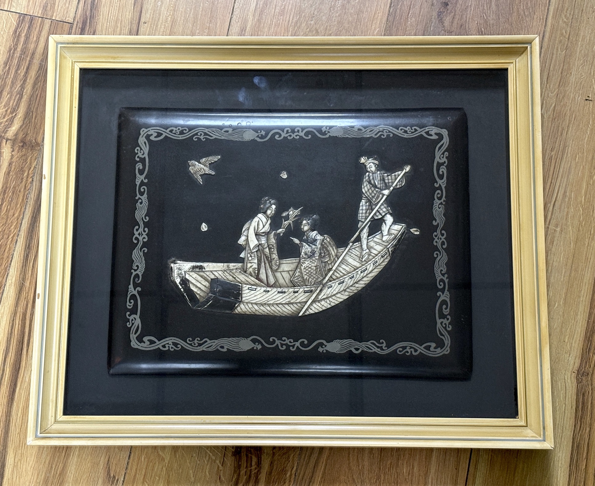 A framed Japanese bone and lacquer panel (album cover), the panel 35 x 27cm